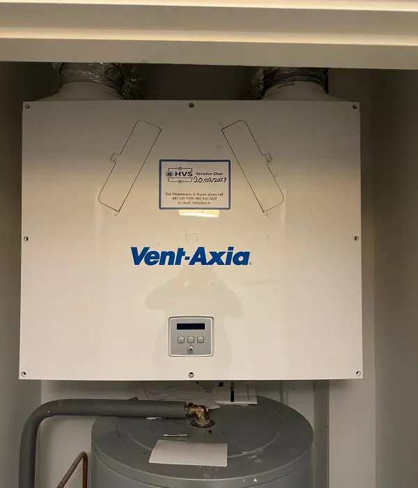 HVS technician servicing a domestic ventilation unit on-site